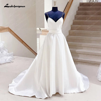 Roycebridal Satin A Line Wedding Dresses with Bow Backless 2025 Summer Beach Robe Satin Sexy Bridal Gowns Spaghetti Straps