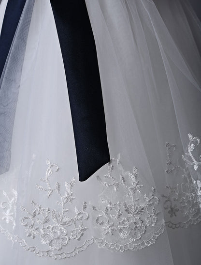 Ivory Tulle flower girl dress With Lace Applique And Navy Blue Sash-showprettydress