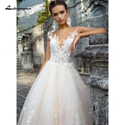 Gorgeous Tulle A-Line Wedding Dresses Illusion Boat Neck Low Open Back Cap Short Sleeve Chapel Train Bride Gowns Appliques Bead - ROYCEBRIDAL OFFICIAL STORE